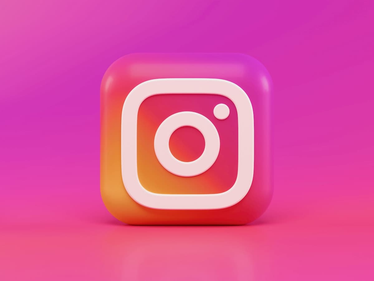 Instagram app on a phone — comment-to-DM keyword trigger concept